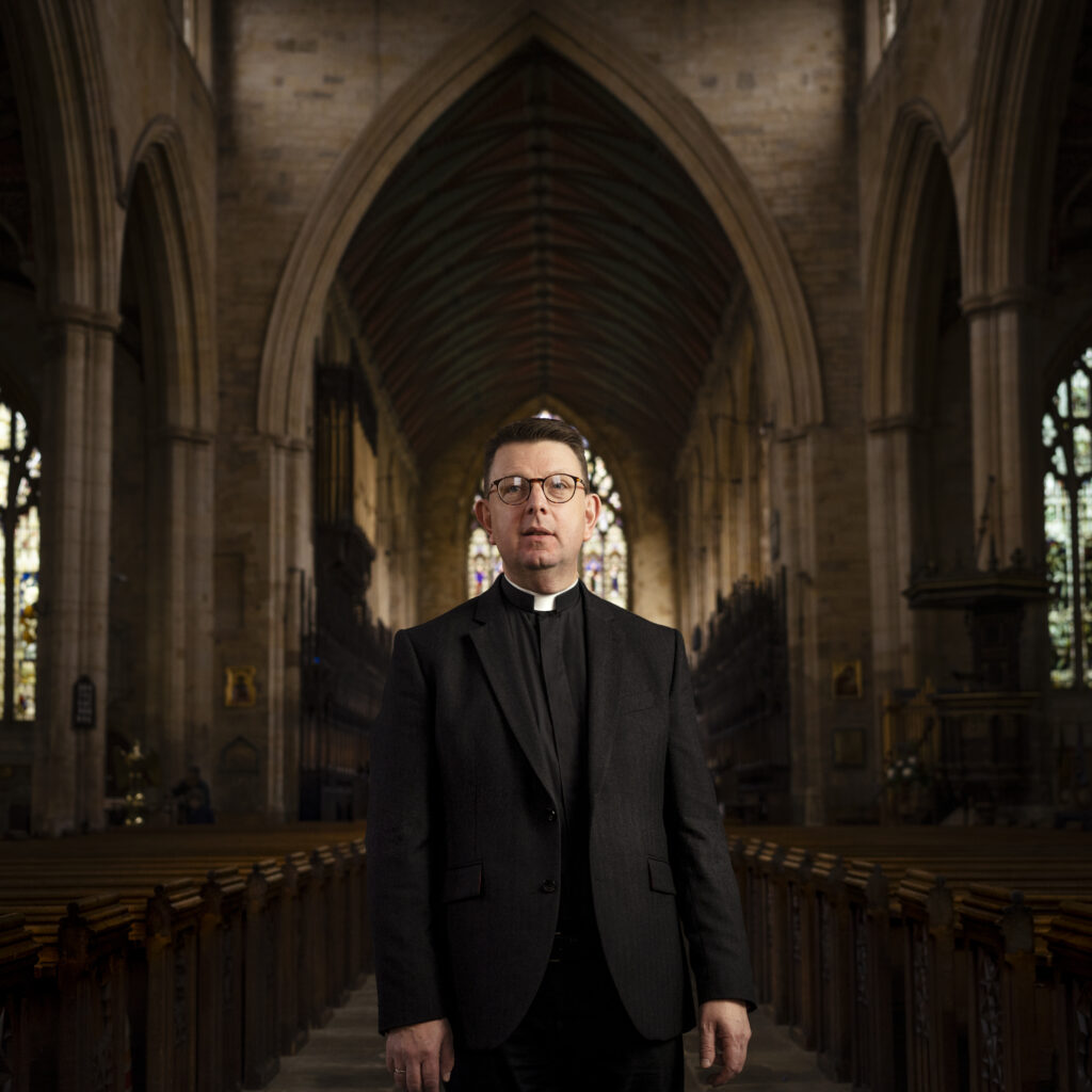 Portrait by Steven Hatton of a local figure inside St Botolph’s Church, Boston, featuring the historic nave interior