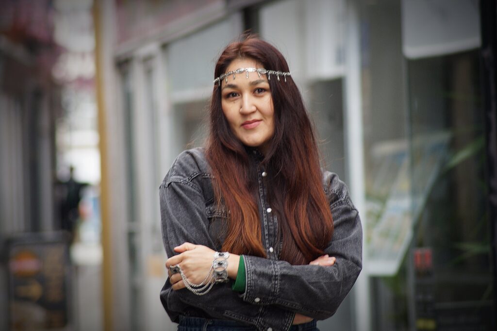 Portrait by Bartosz Fedkowicz of a Boston resident wearing a silver headpiece and denim jacket, featured in Kaleidoscope exhibition