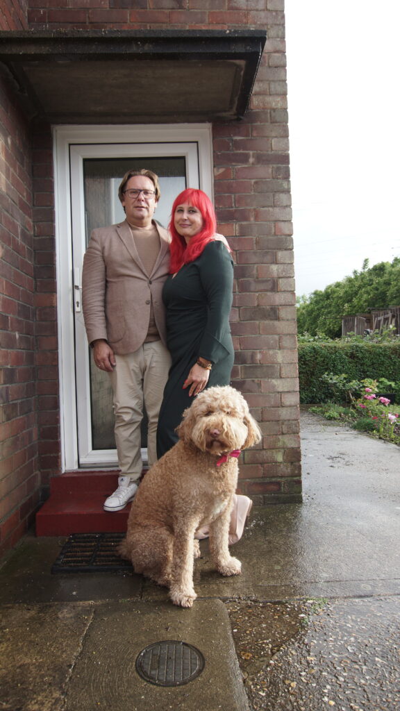 Portrait by Bartosz Fedkowicz of residents with their dog outside a home on Windsor Crescent, Boston, for On Your Doorstep