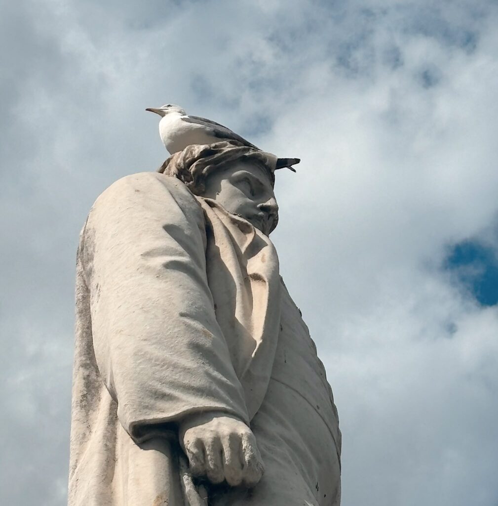 Herbert Ingram memorial statue with a  seagull sat atop the statue's head