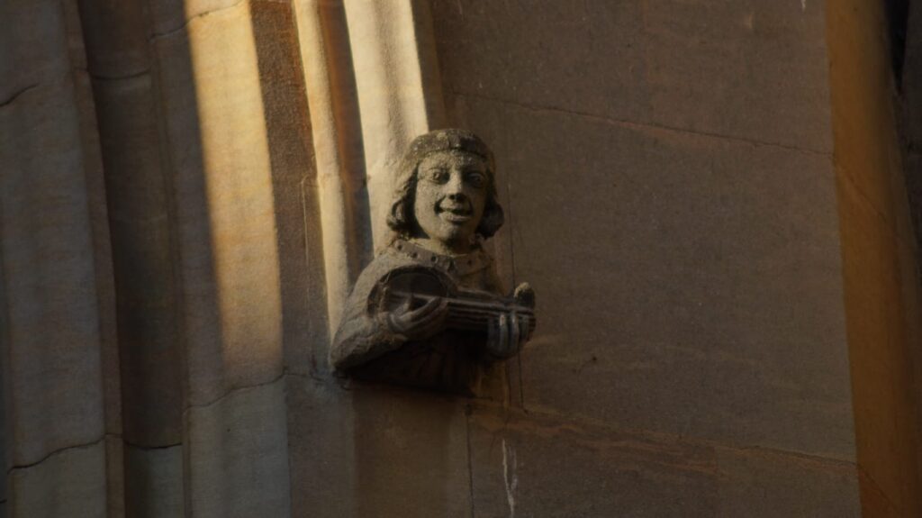 Stone carved bust attached to a building