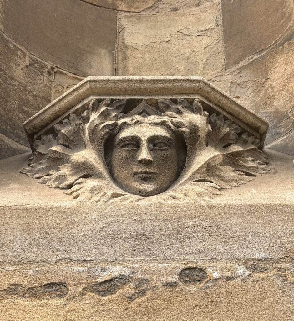 Stone carving of a human face by Ruth Pigott of the Boston Stump