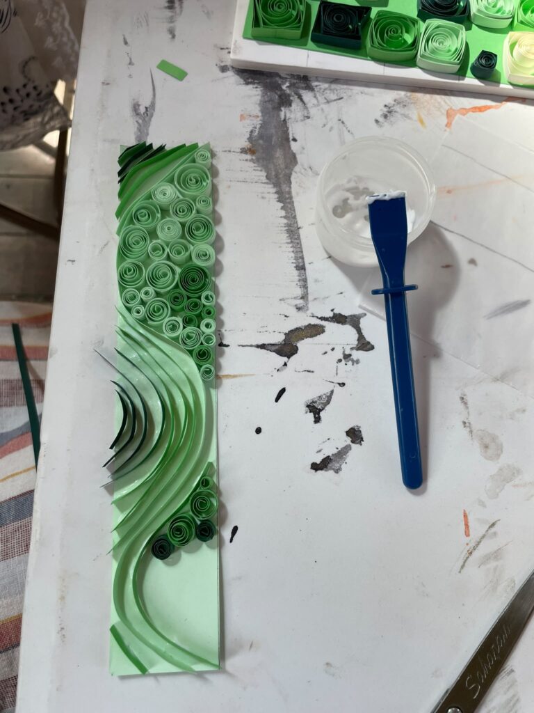 Colourful green quilling design