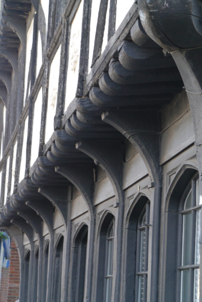 Close up of the wooden features of the tudor-esque exterior of Shodfriars Hall in Boston