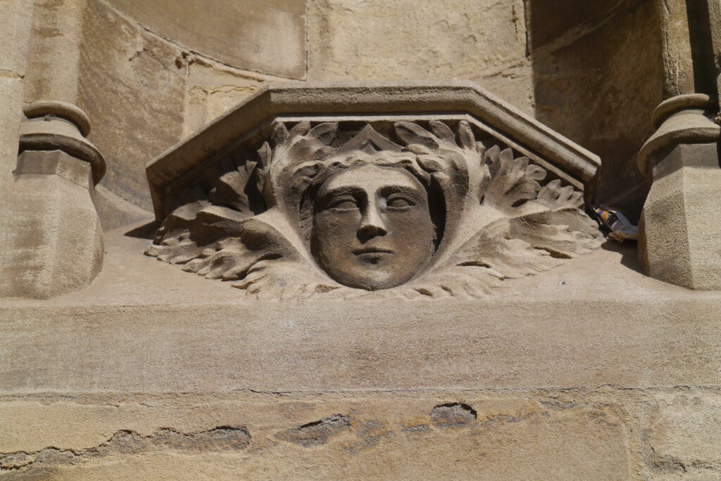 Close up of a stonecarved face in limestone