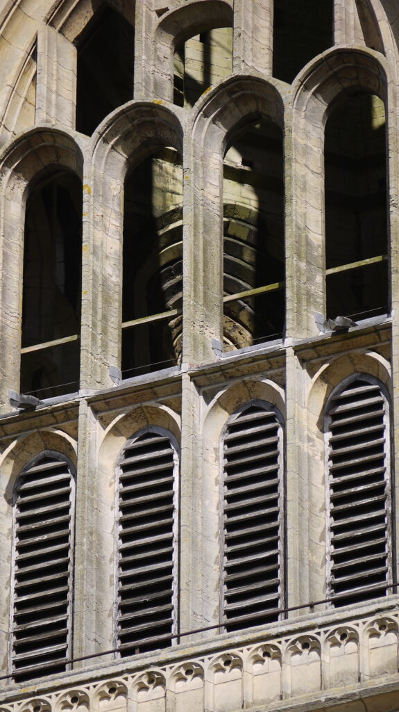Close up of stone carved windows at the top of St Botolphs Bell Tower