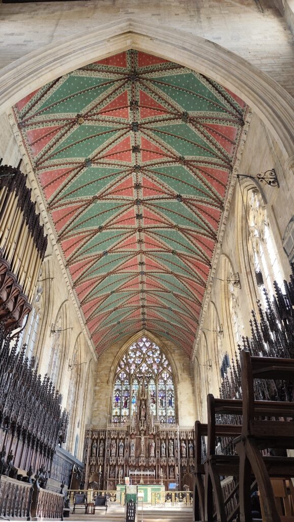 A picture of the interior of St Botolphs, focused on the colourful ceiling