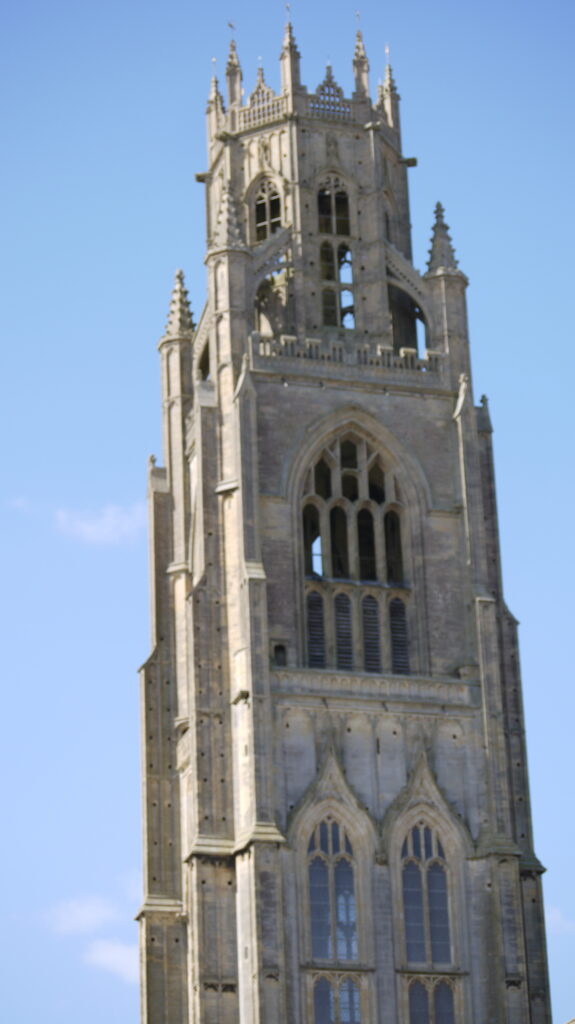 Exterior of St Botolphs Church Tower against a blue sky
