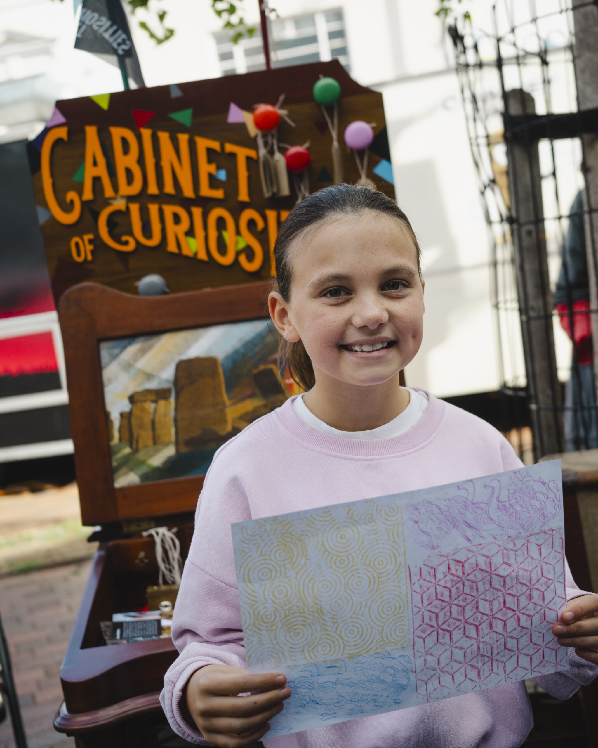 Children and families exploring the Cabinet of Curiosities in Spalding