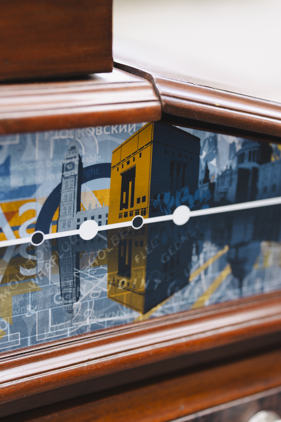 A close-up image of the Lincolnshire-inspired artwork (a blue, digitally illustrated skyline of UK landmarks) decorating the Cabinet of Curiosities